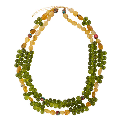 Multistrand necklace with green and yellow beads on a white background