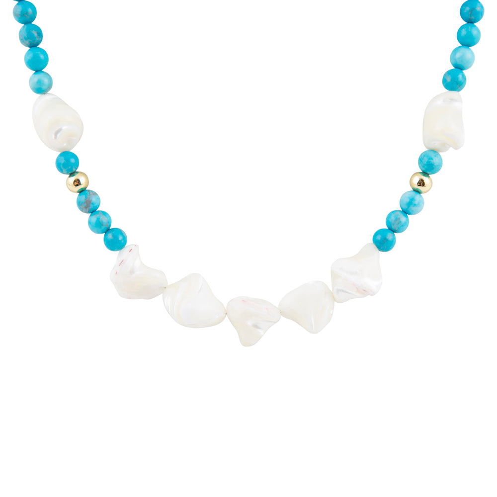 A beaded necklace featuring light blue round beads, irregular white baroque shell beads, and small metallic gold spacer beads, displayed on a clean white background.