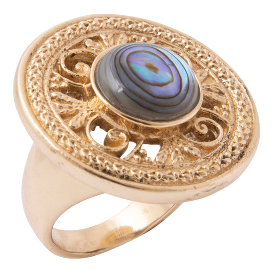 Gold ring with intricate design and a colorful stone on a white background