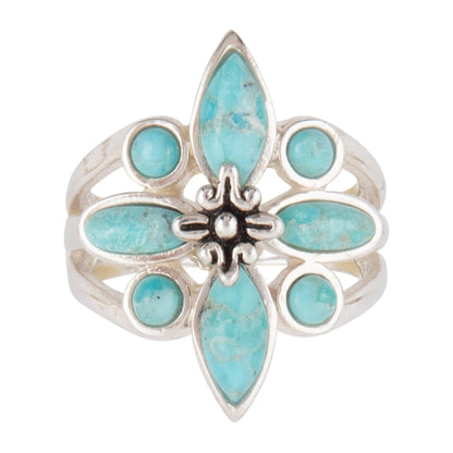 Silver ring with turquoise stones on a white background