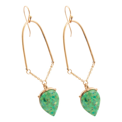 Gold earrings with green teardrop-shaped stones on a white background