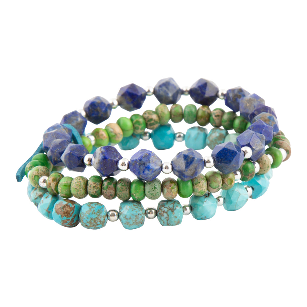 A set of three beaded stretch bracelets featuring faceted lapis lazuli, green jasper, turquoise, and turquoise beads separated by small silver spacer beads, displayed on a clean white background.