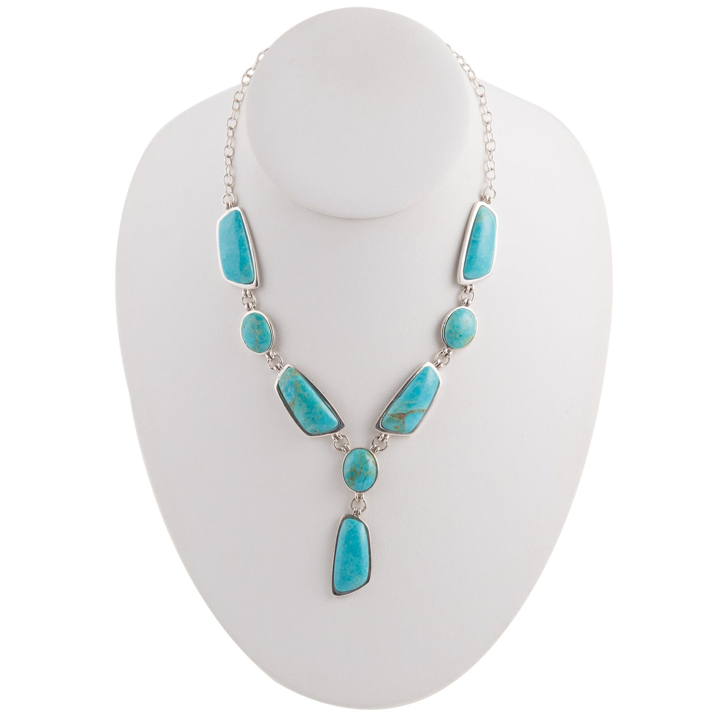 Turquoise necklace on a white mannequin bust