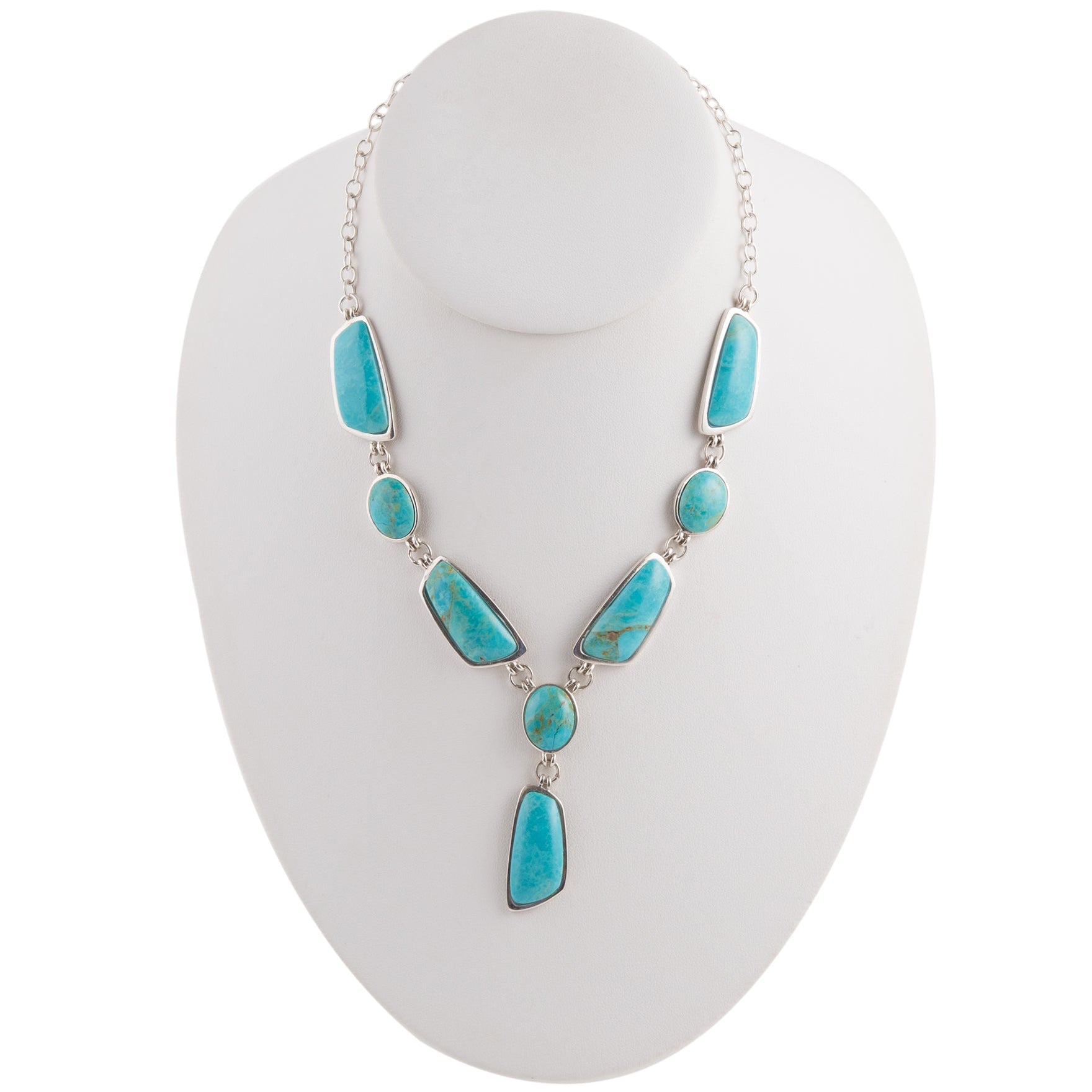 Turquoise necklace on a white mannequin bust