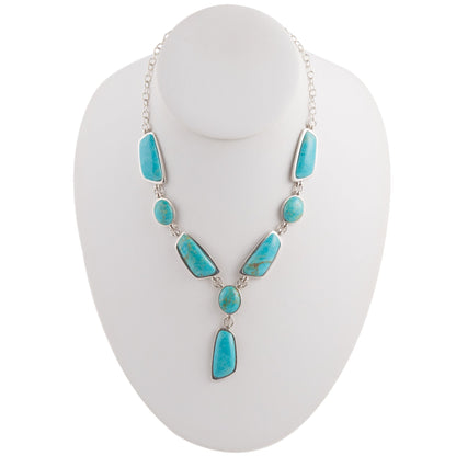 Turquoise necklace on a white mannequin bust