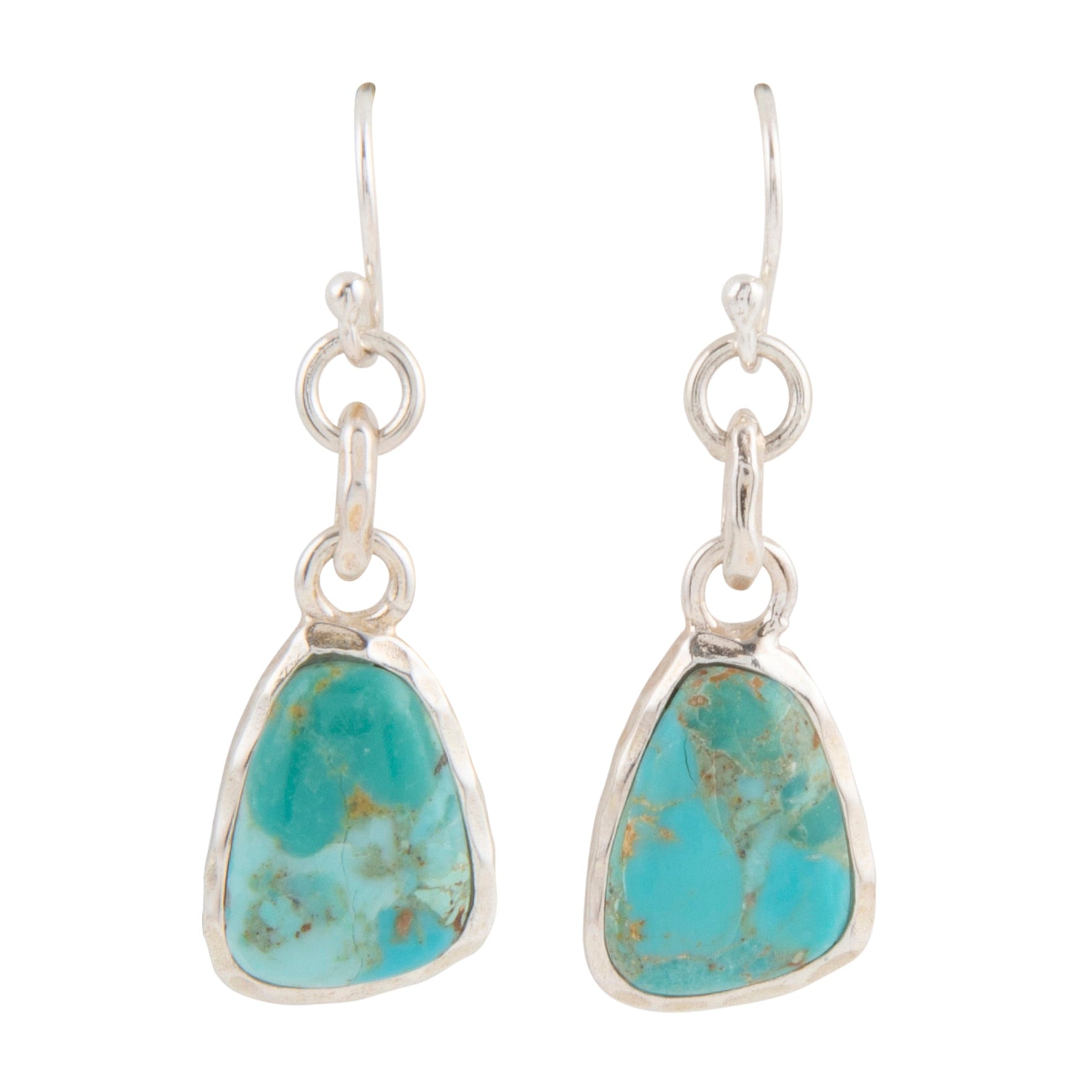 Turquoise teardrop earrings with silver settings on a white background