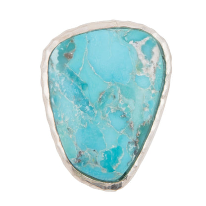 Turquoise stone with silver frame on a white background