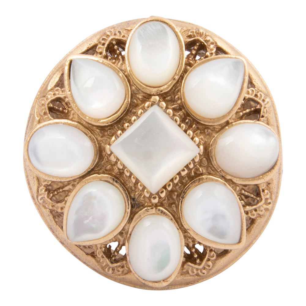 Decorative button with gold frame and white stones on a white background