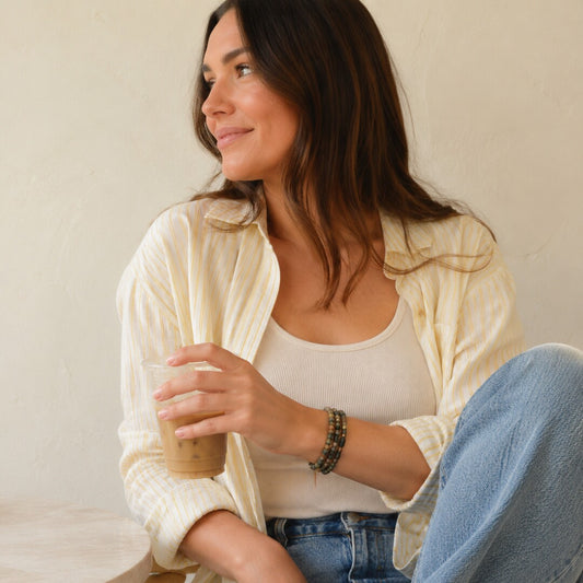 Model wearing the Barse Verdant Glow green agate bracelet set.