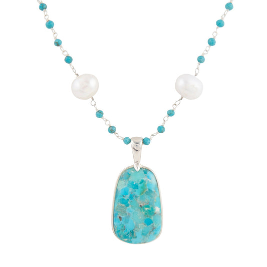 Necklace with turquoise pendant and white beads on a white background