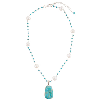 Necklace with pearls and a turquoise pendant on a white background