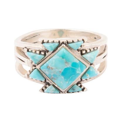 Silver ring with turquoise stones on a white background