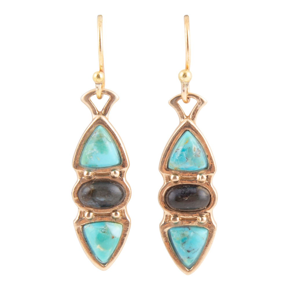 A pair of gold drop earrings featuring light blue turquoise stones, a dark gray stone in the middle, and a smaller light blue stone at the bottom, set in gold-tone metal on a white background.