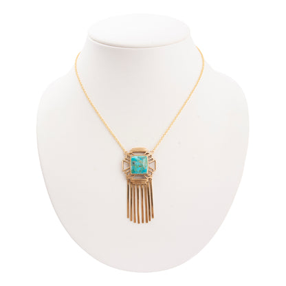 Necklace with a turquoise pendant on a white mannequin bust