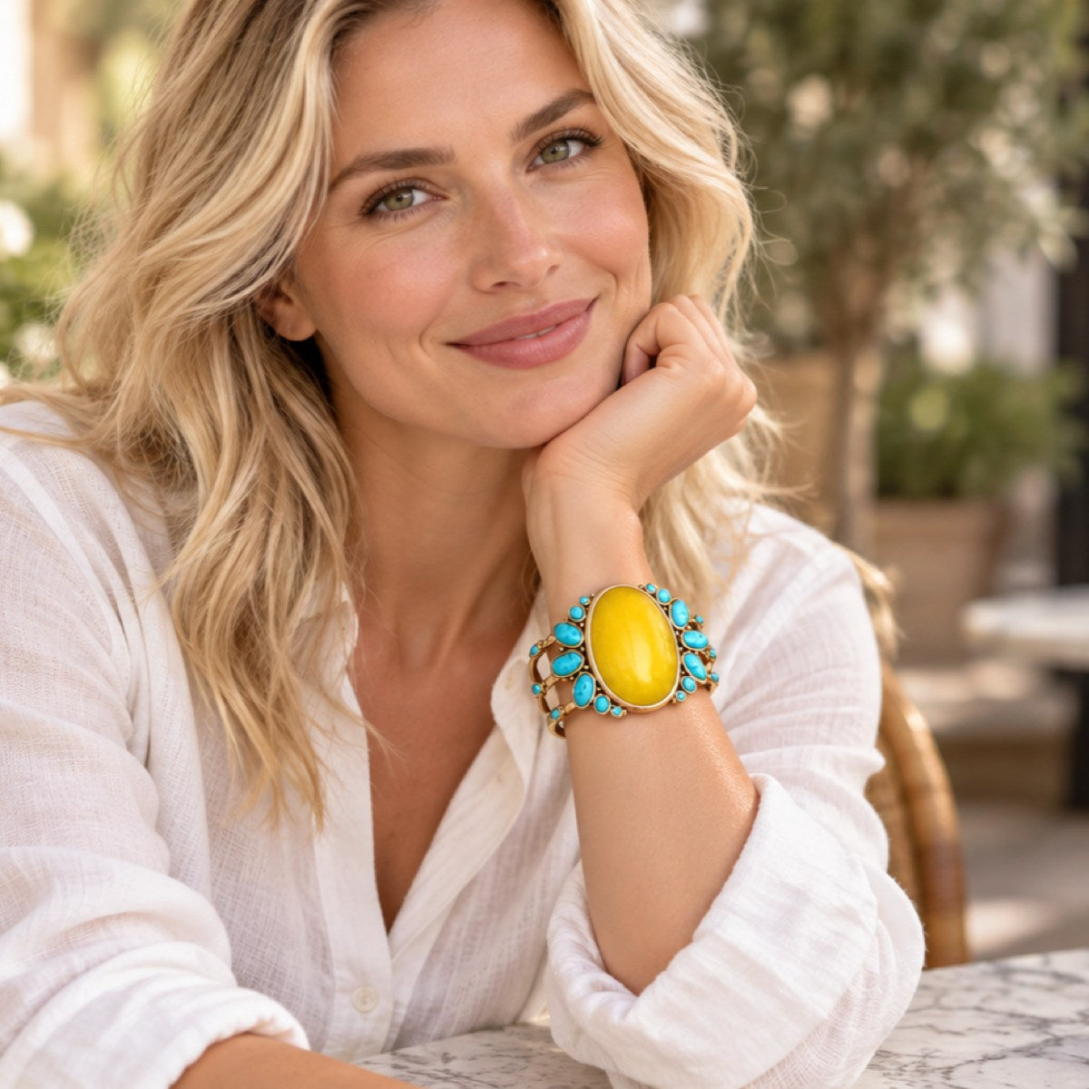 Model wearing Barse MOJAB03OPTB sunny yellow quartz and blue turquoise cuff bracelet.