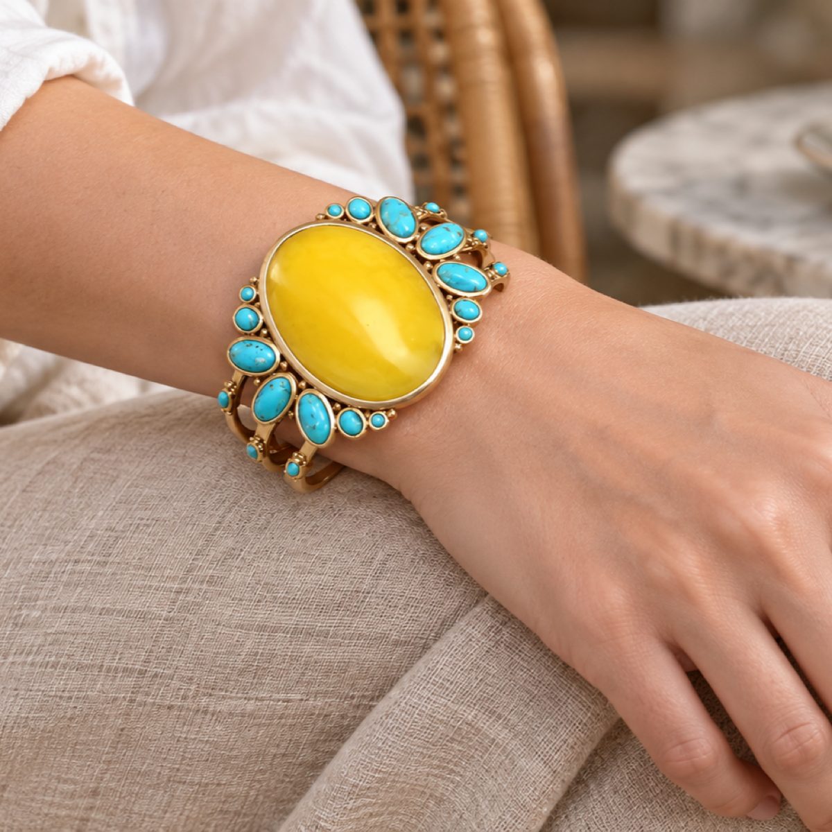 Closeup of Barse MOJAB03OPTB yellow quartz and blue turquoise cuff bracelet on a wrist.