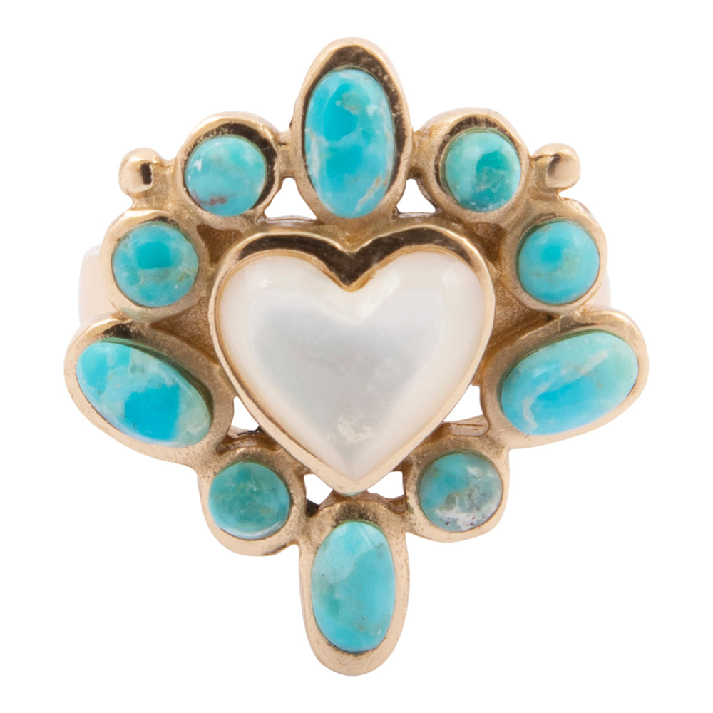 Heart-shaped ring with turquoise stones on a white background