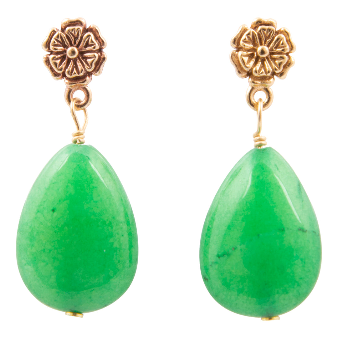 Green teardrop earrings with gold floral tops on a white background