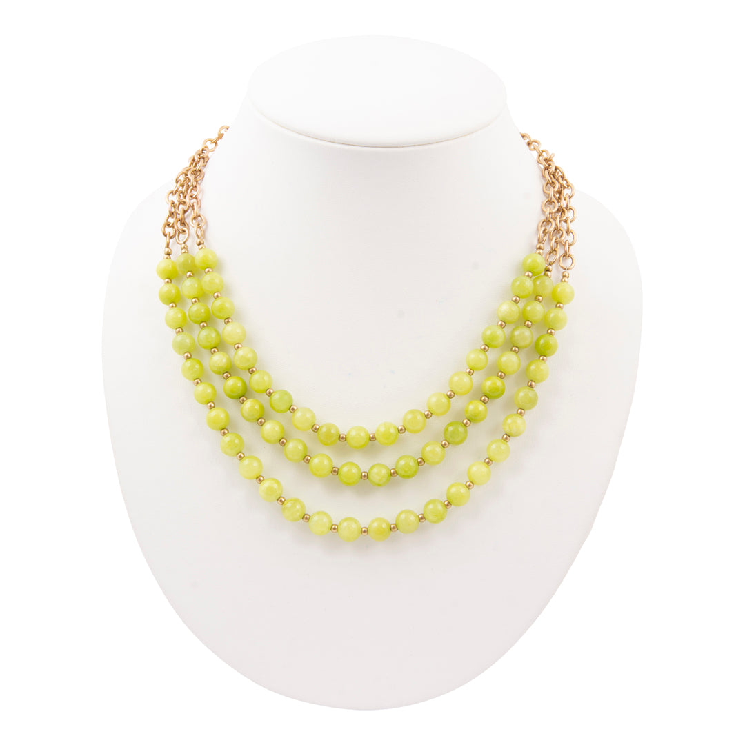 Necklace with yellow beads on a white background