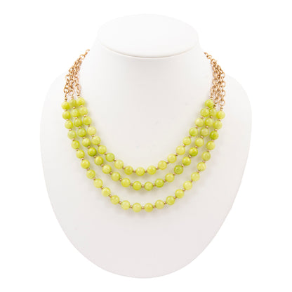 Necklace with yellow beads on a white background
