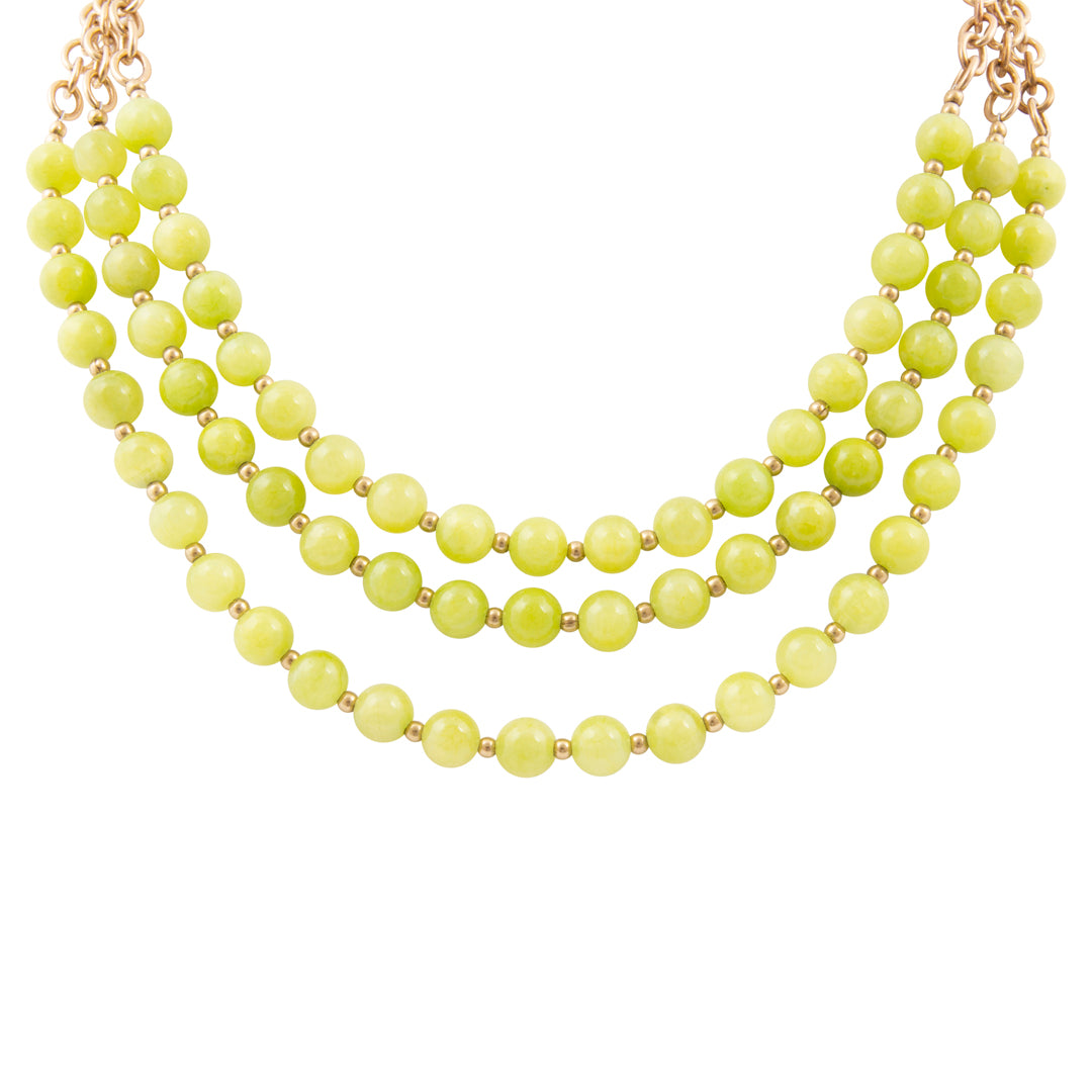 Necklace with green beads on a white background