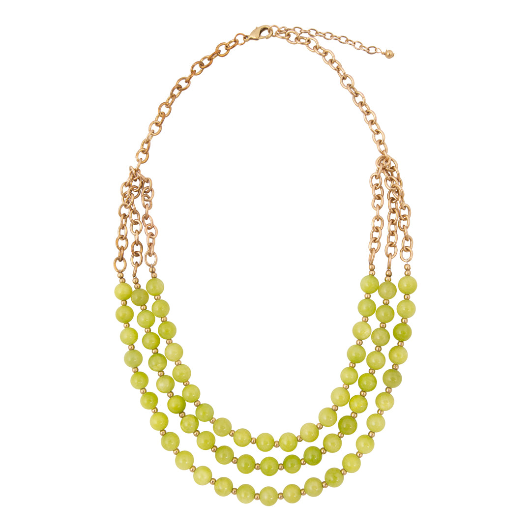 Necklace with green beads and gold chain on a white background