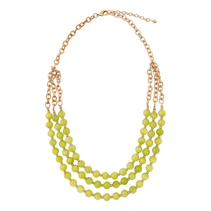 Necklace with green beads and gold chain on a white background