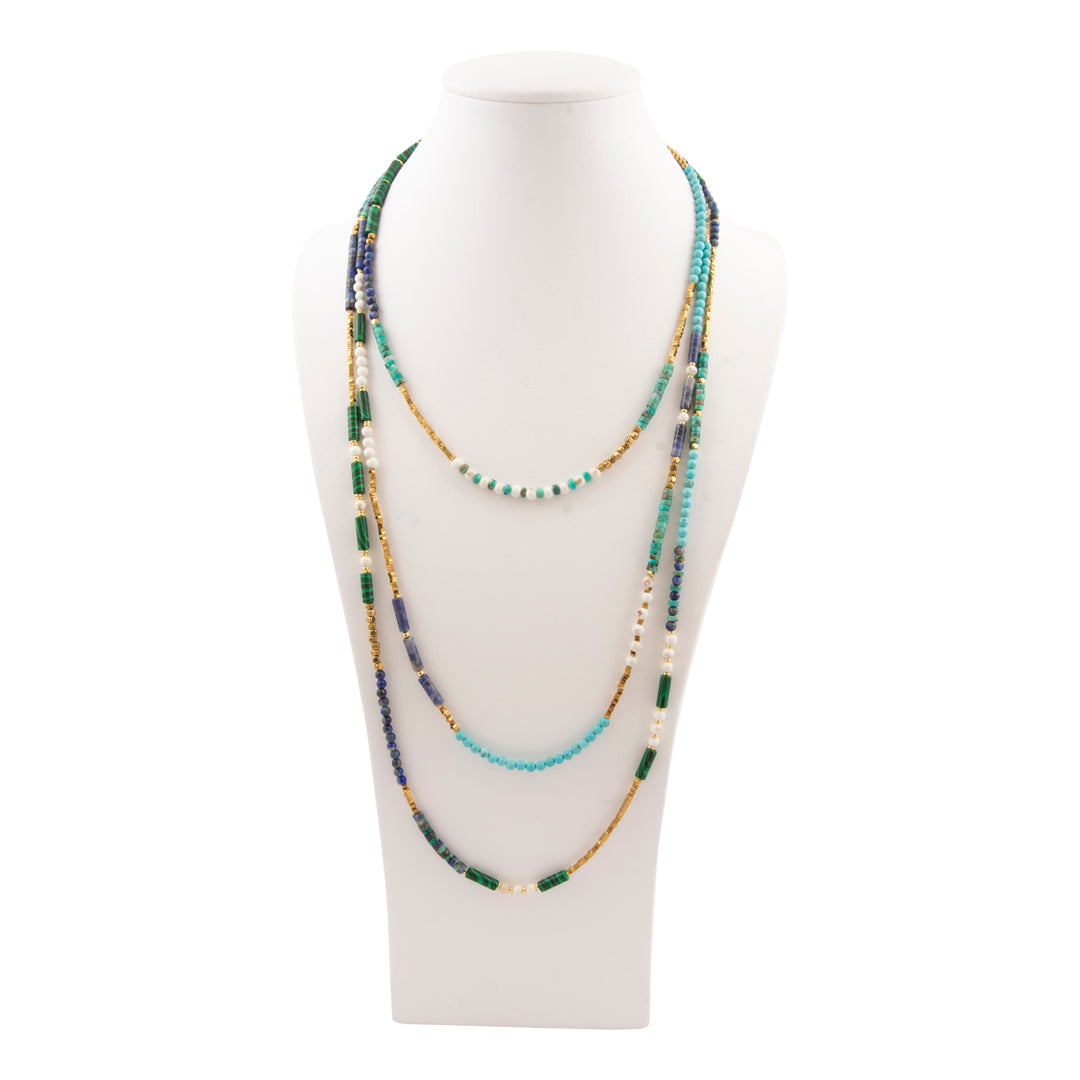 Multistrand beaded necklace on a mannequin bust against a white background
