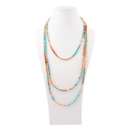 Multistrand beaded necklace on a white mannequin bust