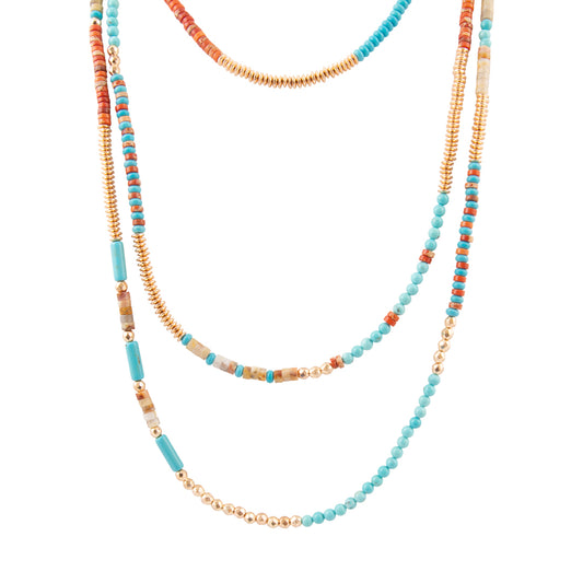 Set of three beaded necklaces with blue, gold, and multicolored beads on a white background