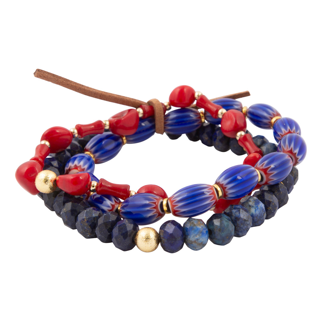 Beaded bracelet with red, blue, and gold beads on a white background