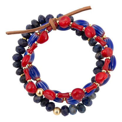 Beaded bracelet with red, blue, and gold beads on a white background