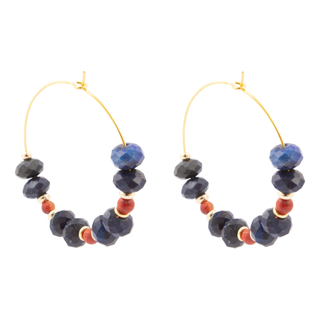 Pair of hoop earrings with blue and red beads on a white background
