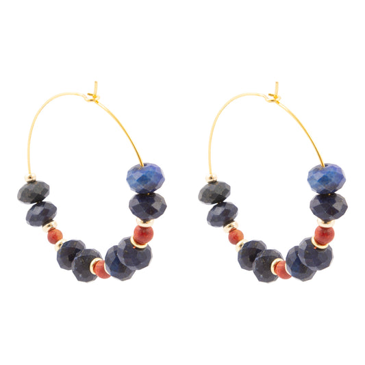 Pair of hoop earrings with blue and red beads on a white background