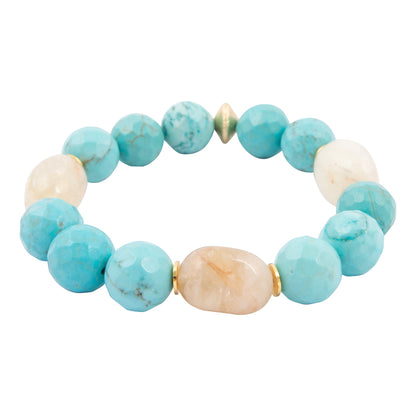 Turquoise and beige beaded bracelet on a white background