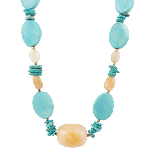 Necklace with turquoise and beige beads on a white background