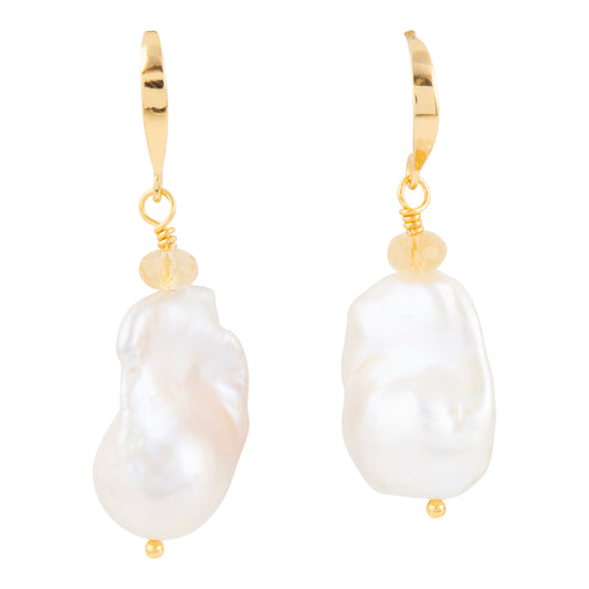 A pair of gold leverback drop earrings featuring irregular white baroque pearls and small gold beads, shown against a plain white background.
