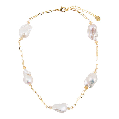 A gold chain necklace featuring irregular white baroque pearls spaced along the chain, displayed on a clean white background.