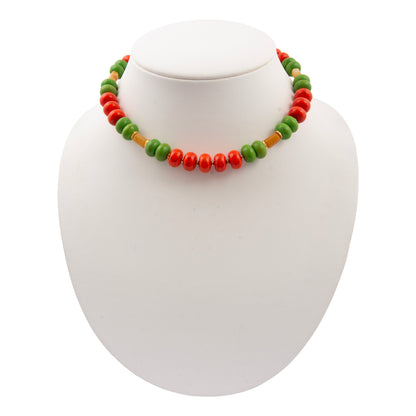 Necklace with green, red, and brown beads on a white background