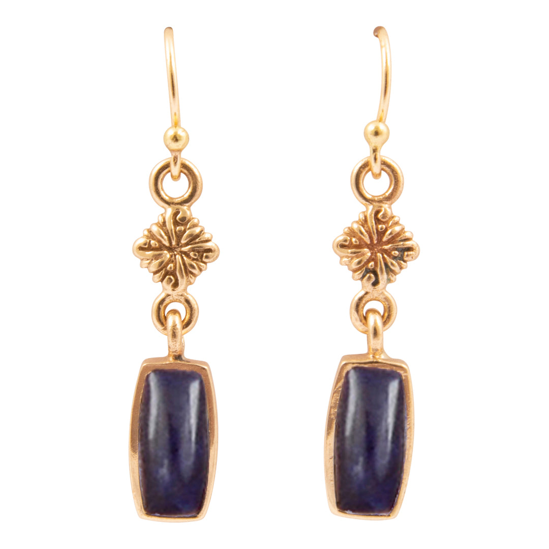 Gold earrings with blue stones on a white background
