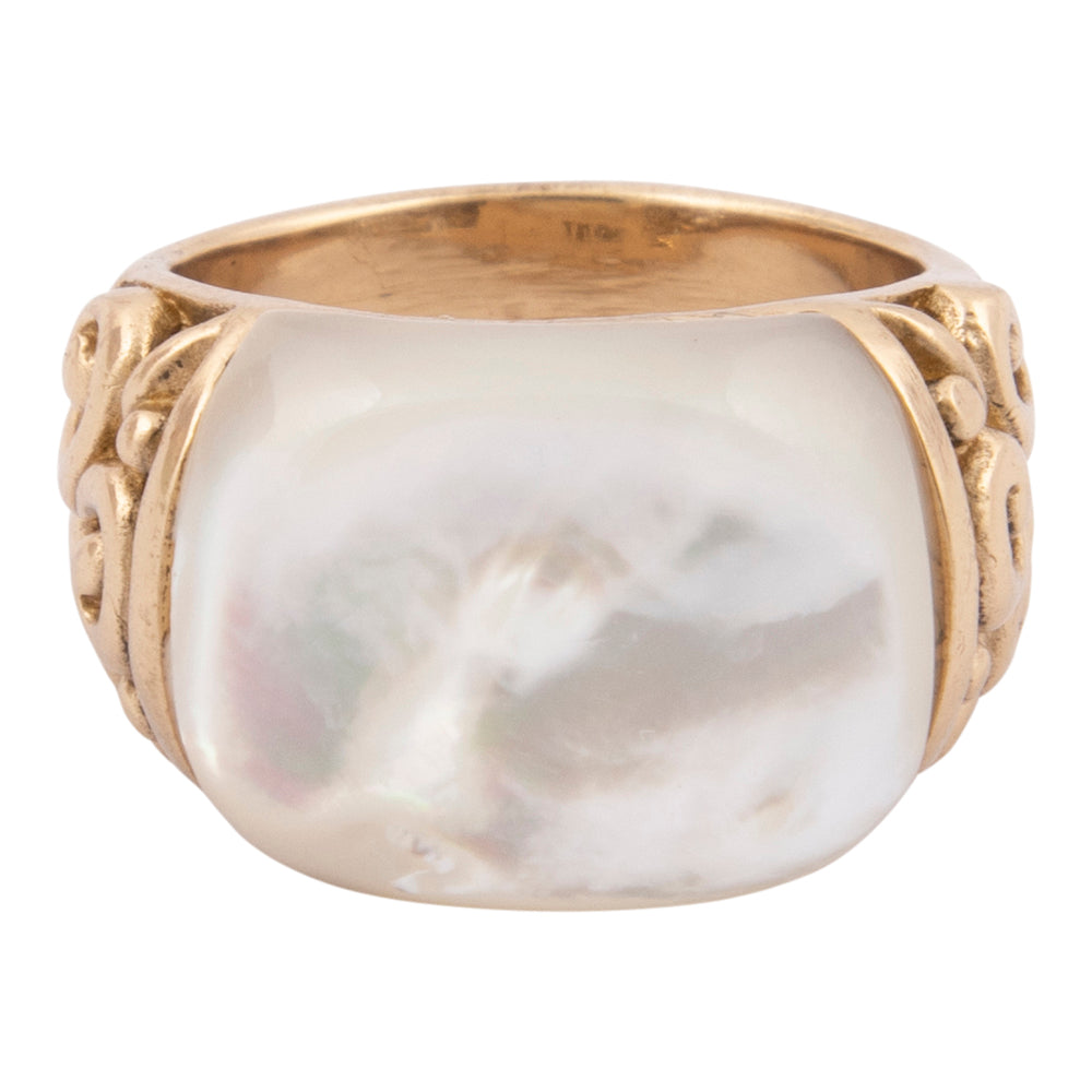 Gold ring with a large white stone on a white background