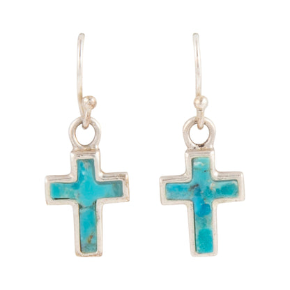 Cross-shaped earrings with turquoise stone inlay on a white background
