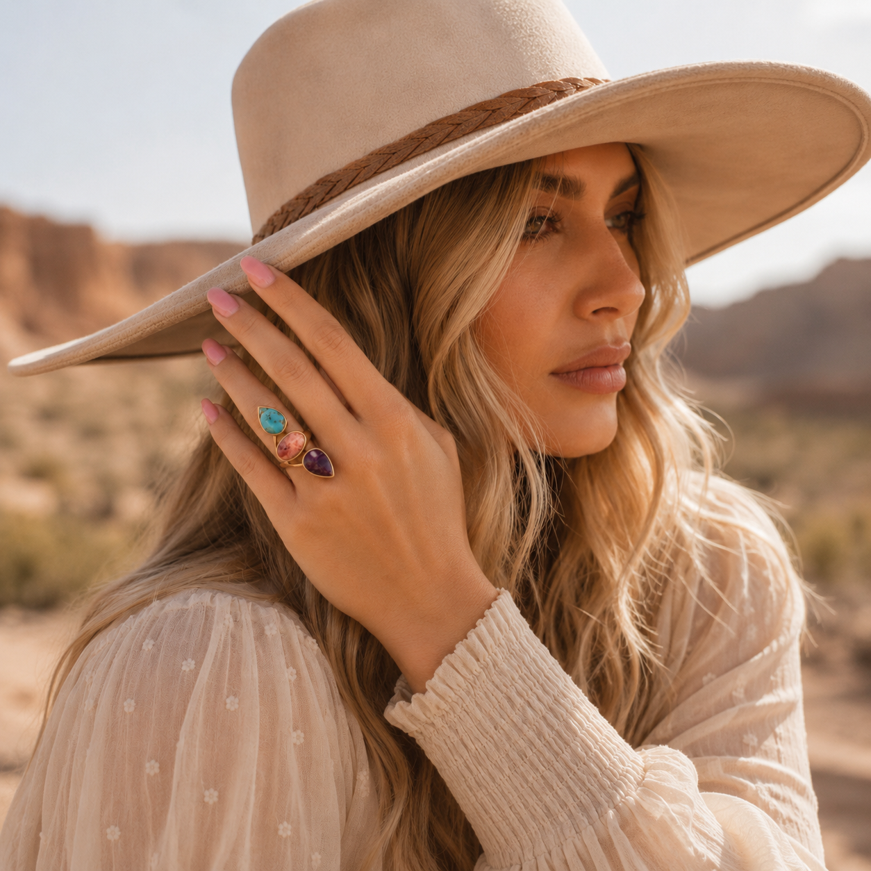 Woman wearing a wide-brimmed hat in a desert setting