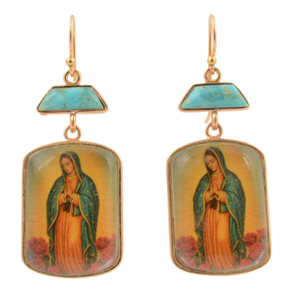 Earrings with religious iconography on a white background