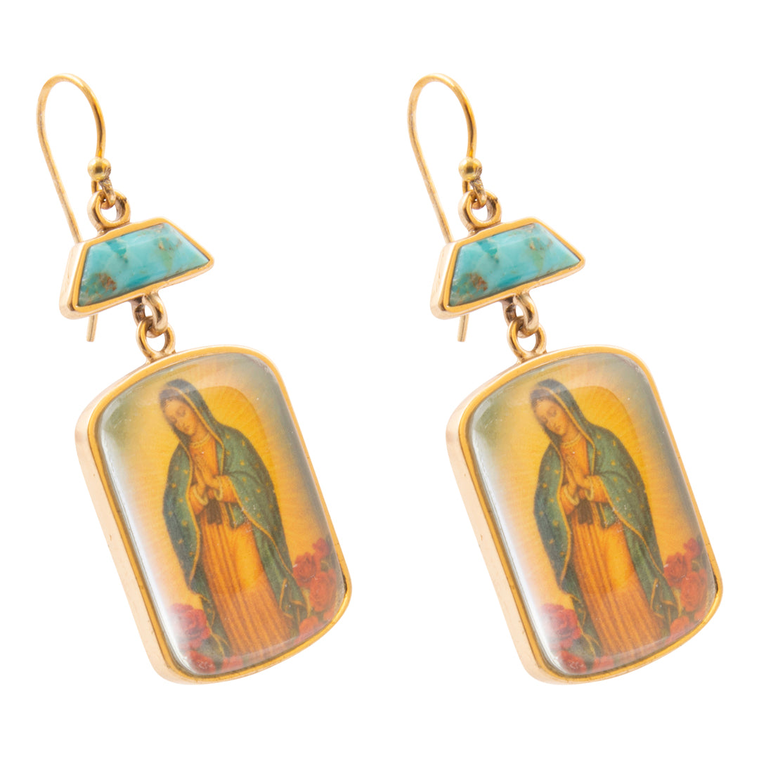 Pair of earrings with religious iconography on a white background