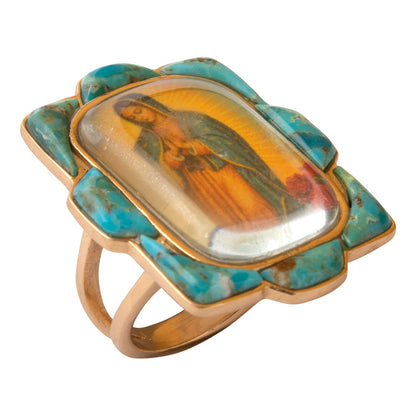 Ring with a turquoise and gold setting featuring an inset portrait on a white background