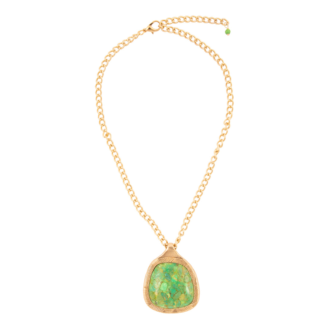Gold necklace with a green pendant on a white background