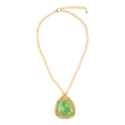 Gold necklace with a green pendant on a white background