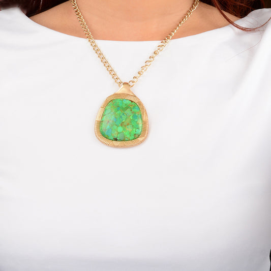 Necklace with a green pendant on a white background