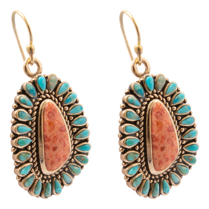 Angled side view of Sedona blue turquoise and orange sponge coral gold-tone drop earrings
